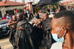 Nana Owusu Korkor II with rifle and headgear at coronation festivities (procession)