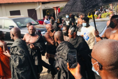 Nana Owusu Korkor II with rifle and headgear at coronation festivities (procession)