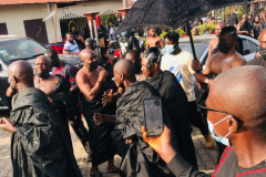 Nana Owusu Korkor II with rifle and headgear at coronation festivities (procession)