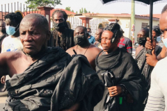 Nana Owusu Korkor II with rifle and headgear at coronation festivities (procession)