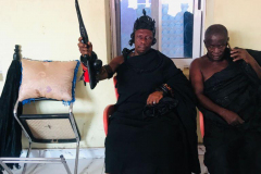 Nana Owusu Korkor II with rifle and headgear at coronation festivities