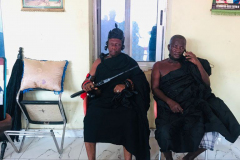 Nana Owusu Korkor II with rifle and headgear at coronation festivities